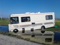 Rockport, TX: Somebody's RV ended up nose first in a puddle of flood water.